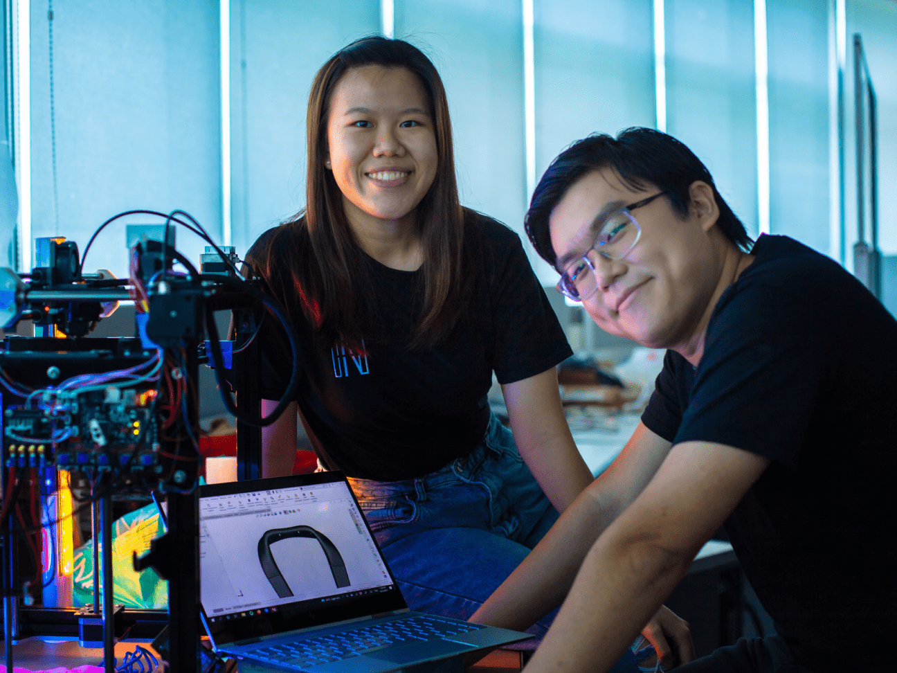 SUTD students with a laptop and robot